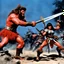 Placeholder: [colour 1960’s stop-motion animation style on the battlefield ] a 70s advertisement video TV featuring a fight begins with great intensity.The barbarian warrior uses her weapons hitting the monster severely ripping pieces of her grotesque and monstrous foe. but the monster is very strong and does not let himself be killed.he attacks with deadly fury the barbara warrior and manages to grab her embracing her with his distorted and very strong arms, full of rigid muscles.he hugs her very tightly