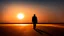 Placeholder: Lone man walking away into the sunset