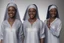 Placeholder: 4 suore africane con tunica grigia figura intera sorrisi, visi armoniosi