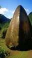 Placeholder: A brown mountain with runestones designed in cave paintings painted by Paul Gauguin