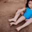 Placeholder: 7 year old girl in blue swimsuit and shoes