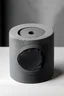 Placeholder: dark gray round liquid soap package, made of concrete, one side folded