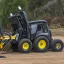 Placeholder: Make a Southern Trace with racked Skid Steer with mulching head attachment attached on Machine professional logo