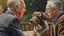 Placeholder: A hyper-realistic oil painting of a whimsical scene where a dog is engaged in deep conversation with an elderly man