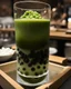 Placeholder: filling the frame we are looking into a tank filled with matcha green bubble tea, dark tapioca pearls along the bottom against the glass, ice floating at top, no fish, no outside of tank
