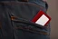 Placeholder: close up of jean pocket with card coming out of pocket